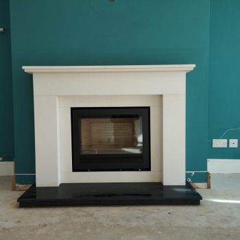 simple limestone Fireplace