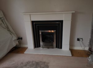 gas fire with white mantelpiece