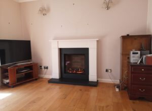 Electric fire with white mantelpiece